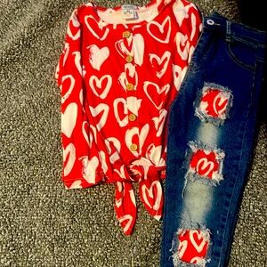 The shirt can tie a knot.And the jeans have see though patch with hearts